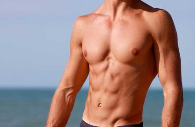 Man with abs after emsculpt treatment in Fremont
