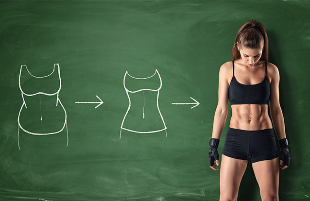 Woman showing emsulpt results in Fremont