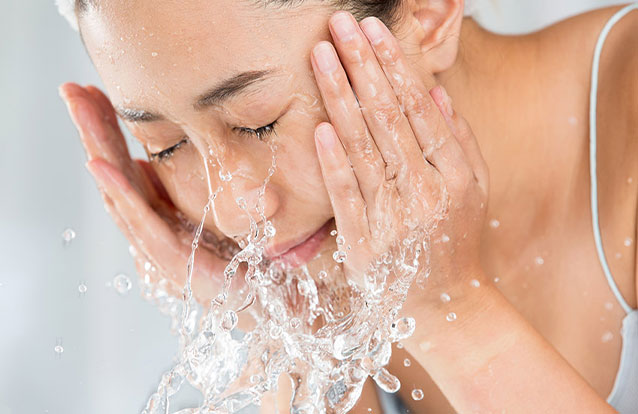 Woman hydrating skin in Fremont