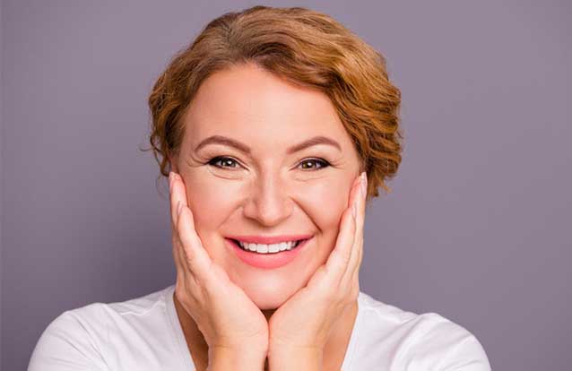 woman happy after exilis treatments in Fremont